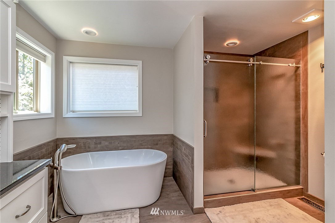 3126 210th Street Southeast Bothell, WA 98021 - Photo 19 of 33 a bathroom with a tub and shower