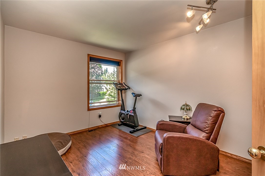 3126 210th Street Southeast Bothell, WA 98021 - Photo 21 of 33 a room with furniture and windows