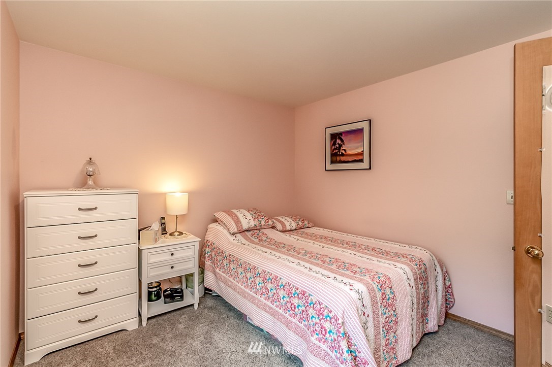 3126 210th Street Southeast Bothell, WA 98021 - Photo 22 of 33 a bedroom with a bed and a closet