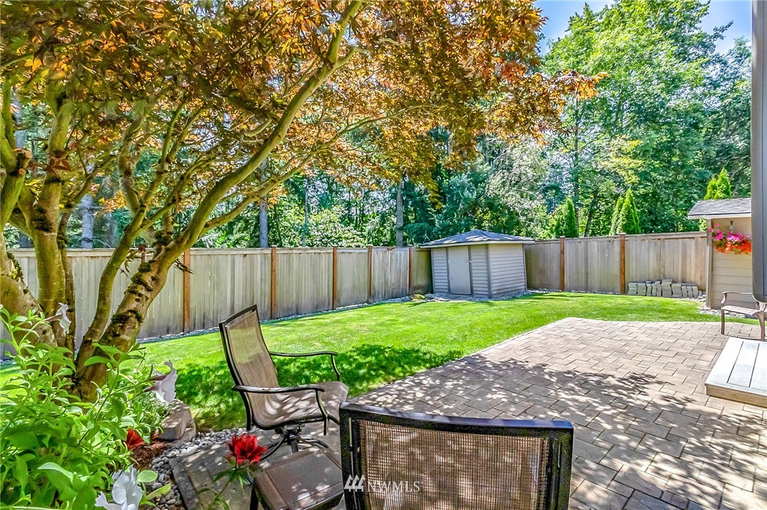 3126 210th Street Southeast Bothell, WA 98021 - Photo 23 of 33 a backyard of a house with lots of green space