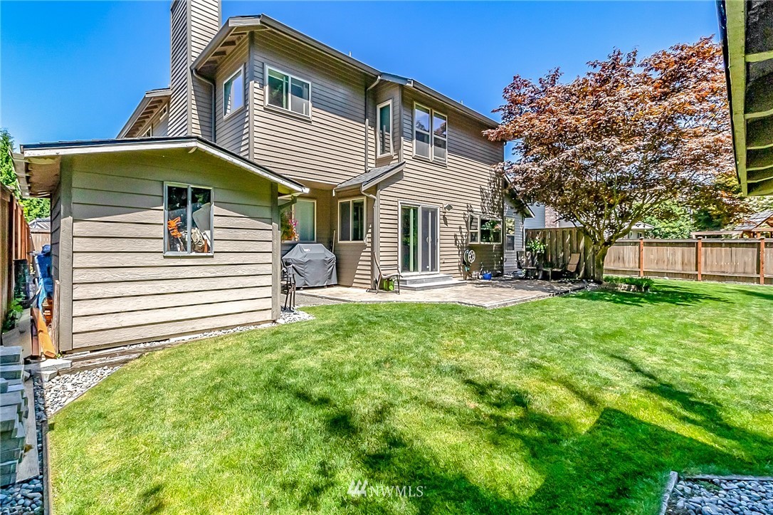 3126 210th Street Southeast Bothell, WA 98021 - Photo 24 of 33 a front view of a house with a yard
