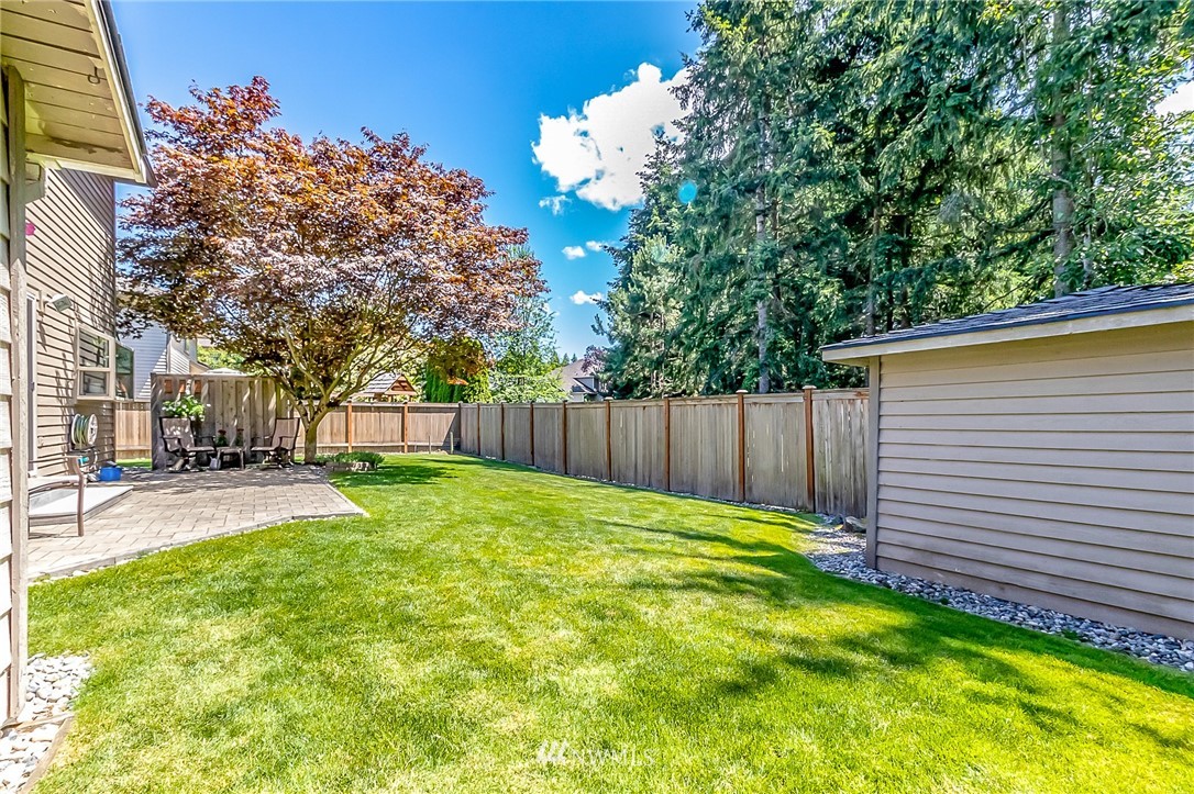 3126 210th Street Southeast Bothell, WA 98021 - Photo 25 of 33 a view of a backyard with a small cabin