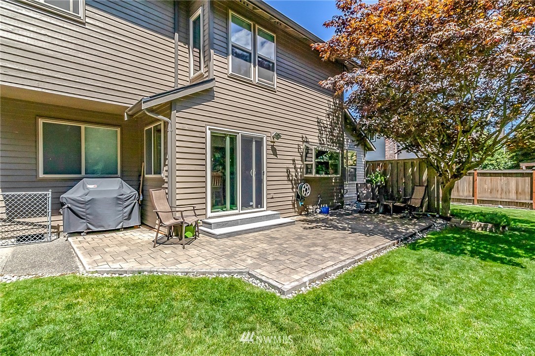 3126 210th Street Southeast Bothell, WA 98021 - Photo 27 of 33 a view of a house with backyard and sitting area