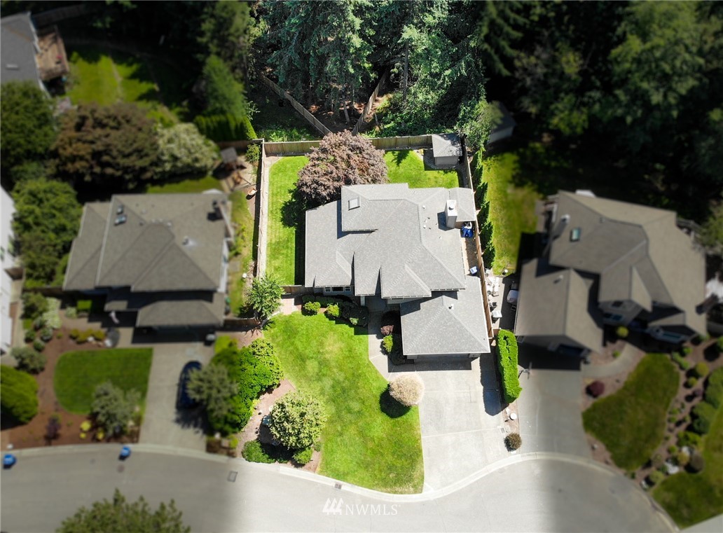 3126 210th Street Southeast Bothell, WA 98021 - Photo 31 of 33 an aerial view of house with yard and swimming pool