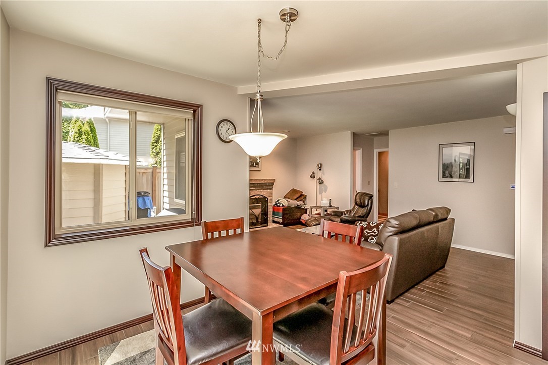 3126 210th Street Southeast Bothell, WA 98021 - Photo 10 of 33 a dining room with furniture and window