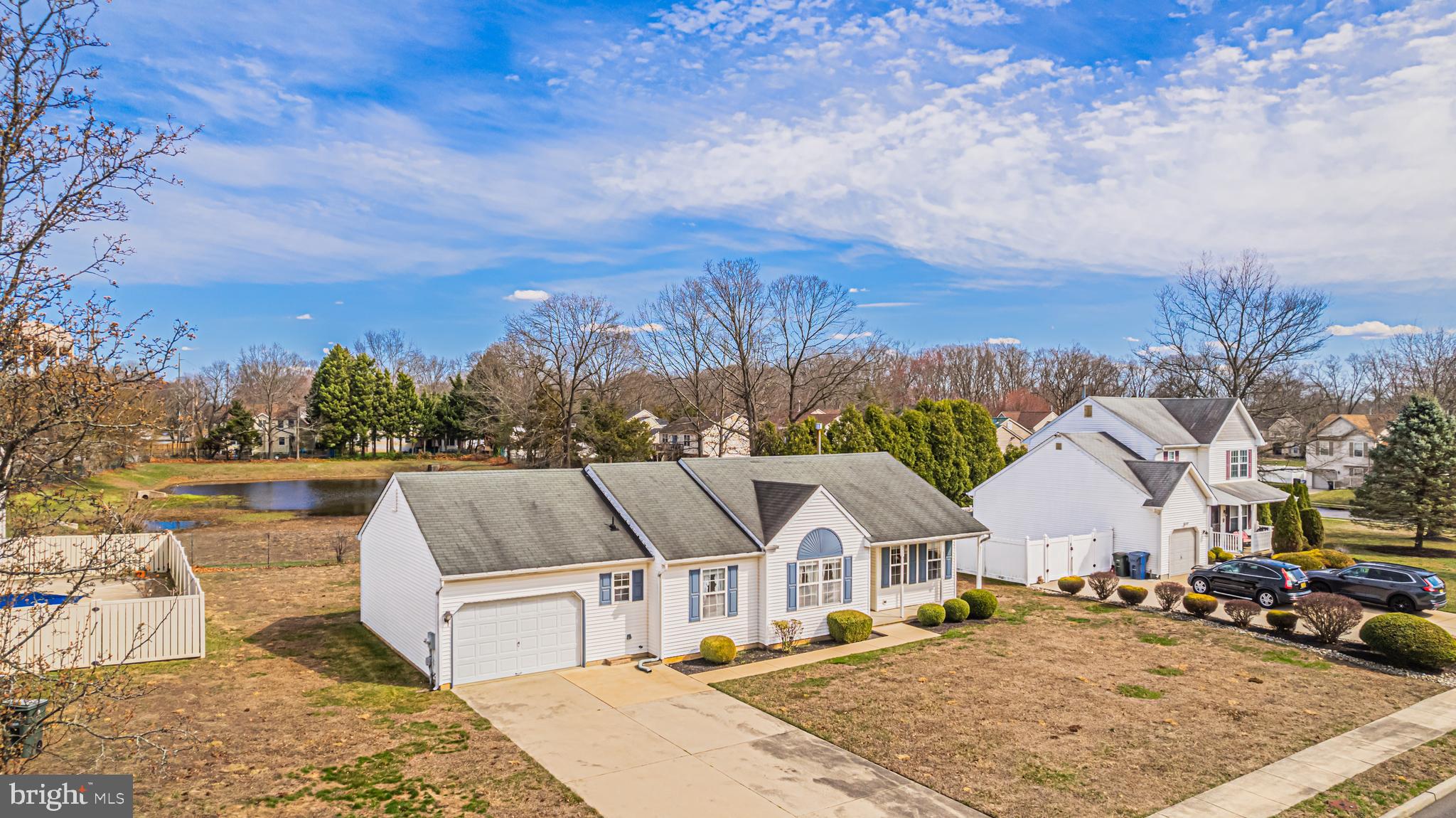 333 Copperfield Drive Williamstown, NJ 08094 - Photo 1 of 17 a view of a white house with a yard and roof