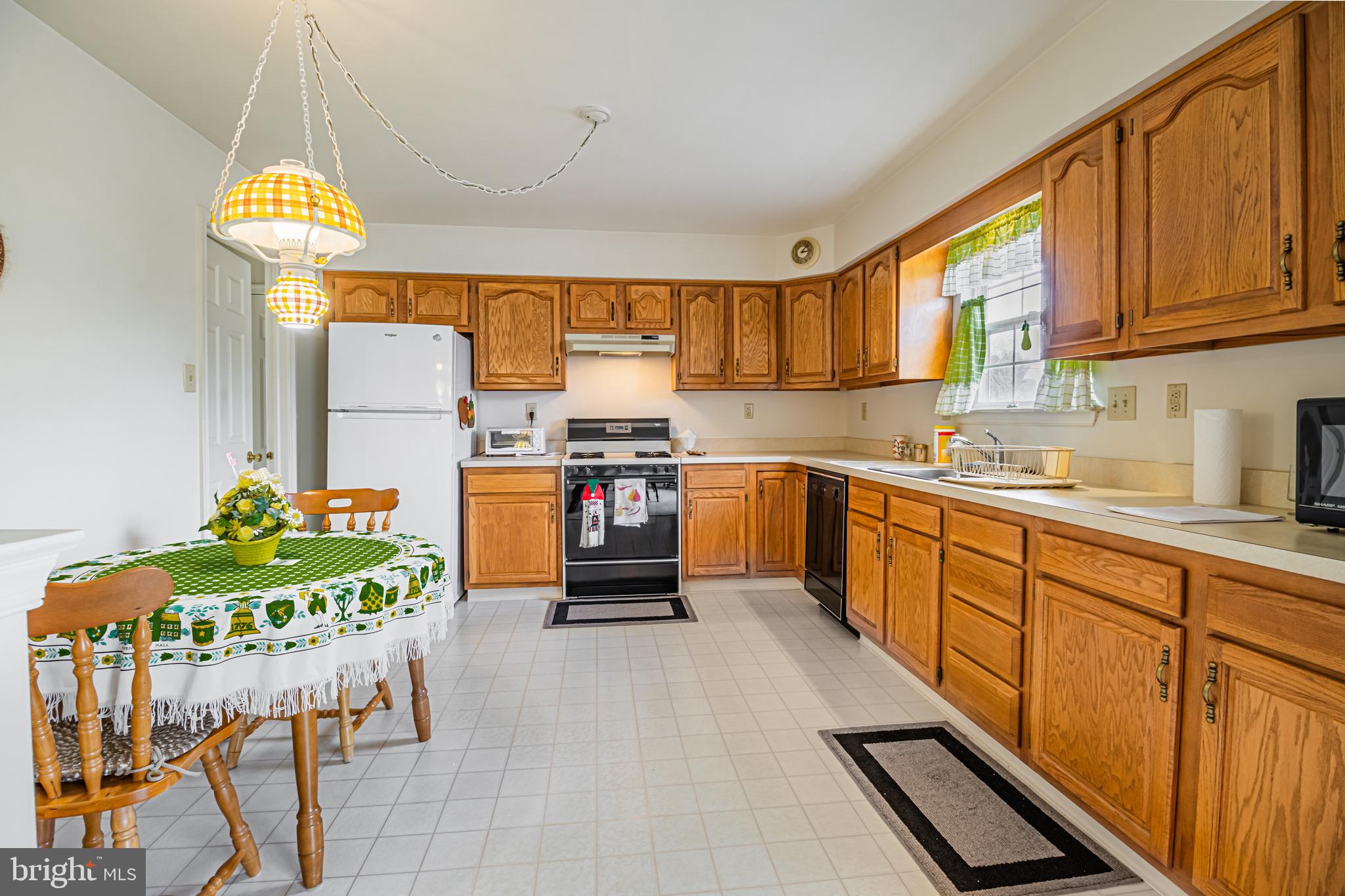 333 Copperfield Drive Williamstown, NJ 08094 - Photo 3 of 17 a kitchen with stainless steel appliances kitchen island granite countertop a stove a sink and a refrigerator