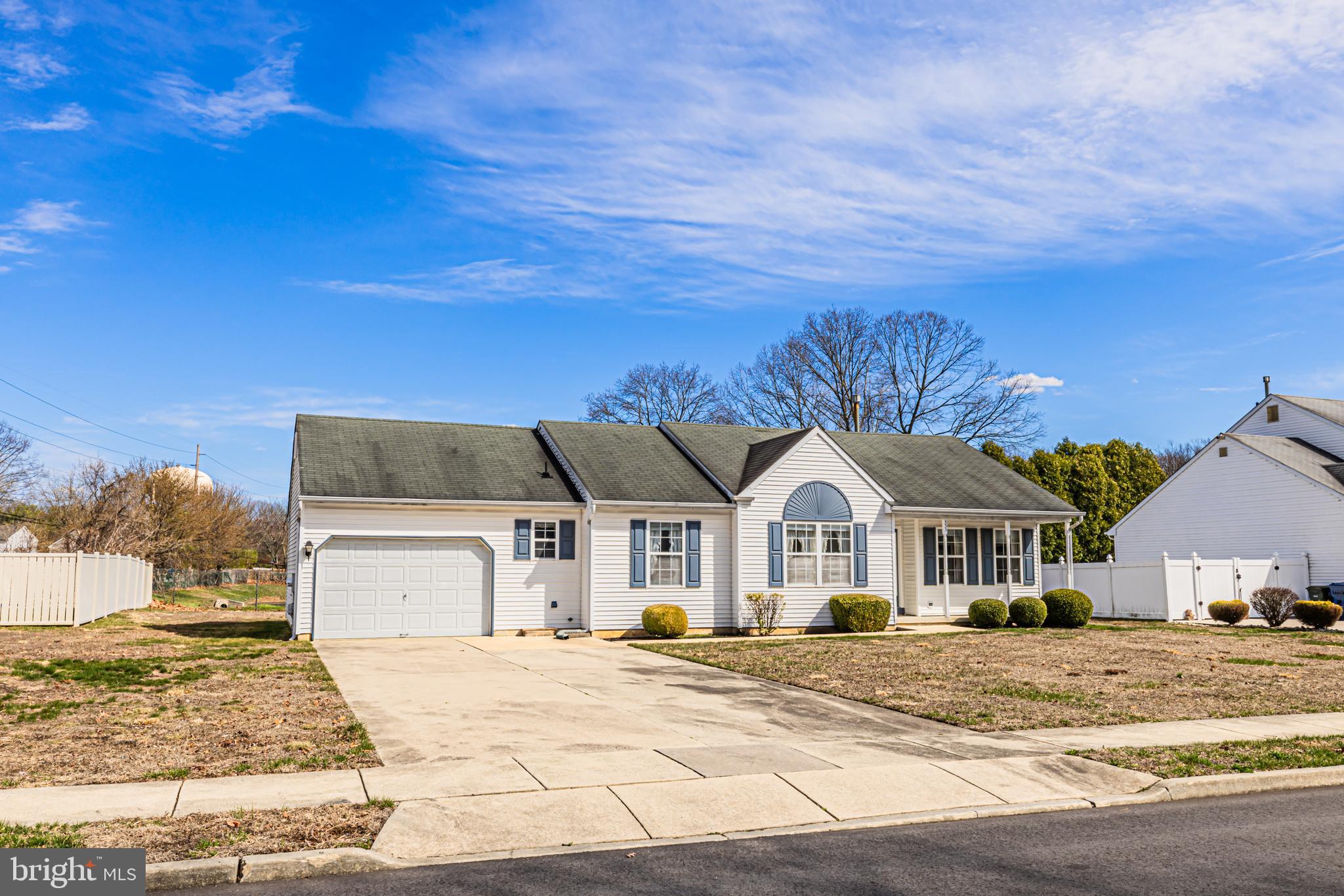 333 Copperfield Drive Williamstown, NJ 08094 - Photo 7 of 17 a front view of a house with a yard