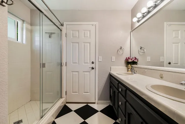 a backyard of a house with barbeque oven