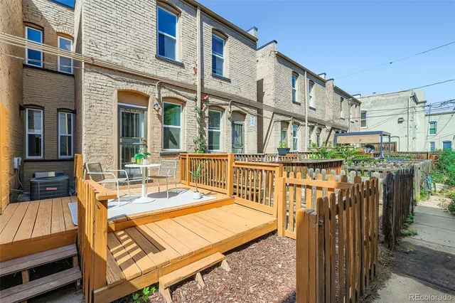 a view of a brick building with many windows