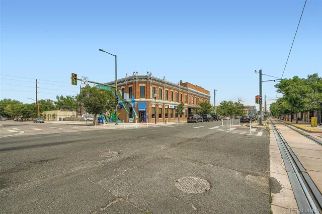 a view of a garden with a building in the background