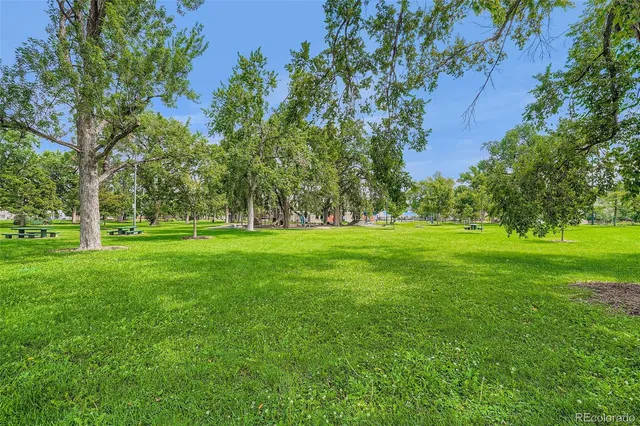 a view of a street with a building in the background