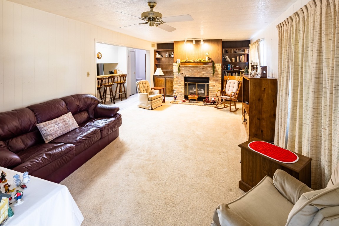 3351 Goforth Road Kyle, TX 78640 - Photo 2 of 8 a living room with furniture and a flat screen tv