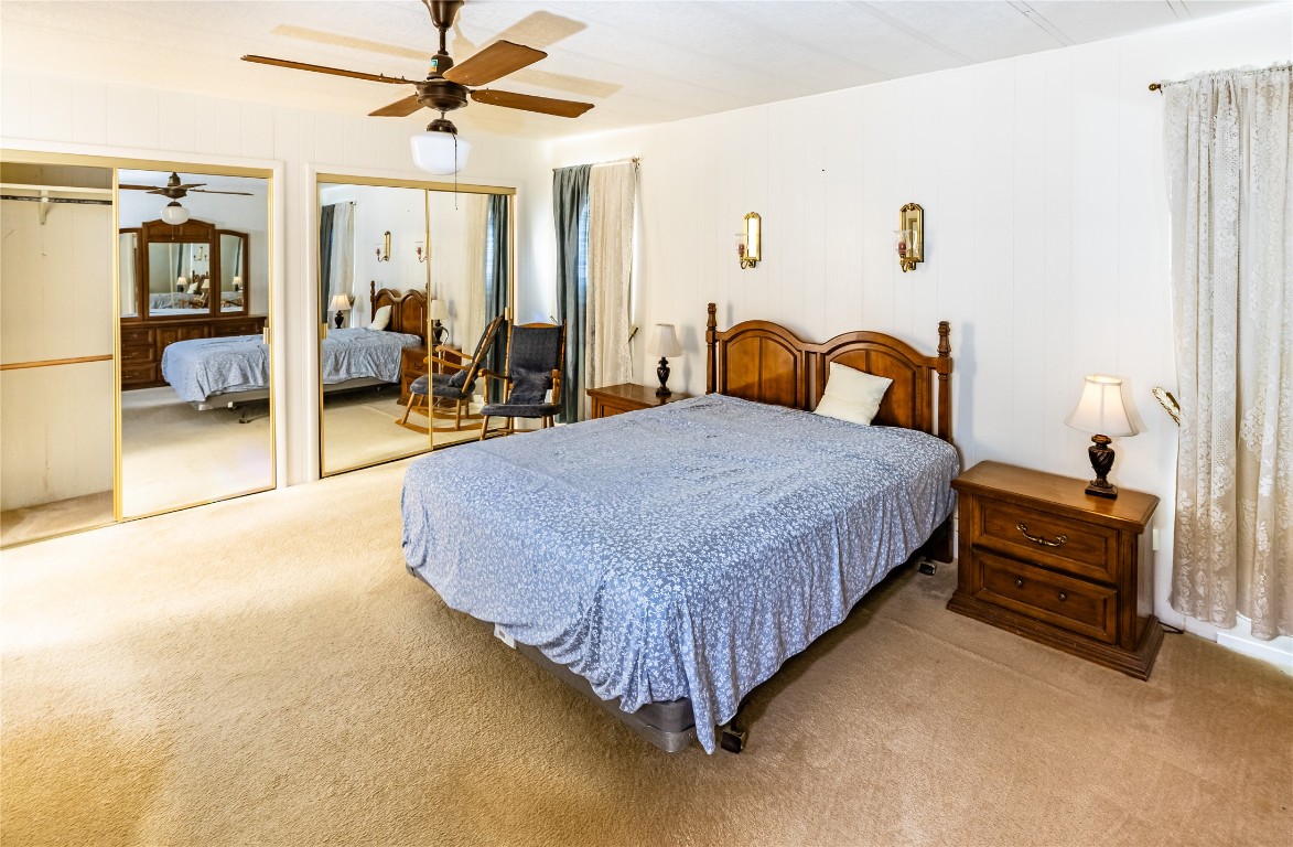 3351 Goforth Road Kyle, TX 78640 - Photo 4 of 8 a spacious bedroom with a bed and dresser