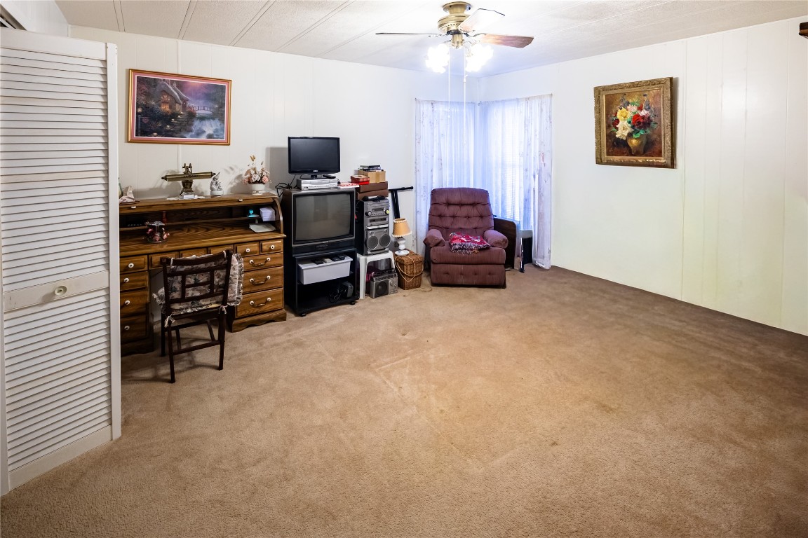 3351 Goforth Road Kyle, TX 78640 - Photo 8 of 8 a living room with furniture and a flat screen tv