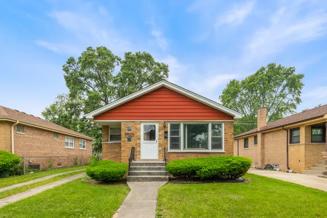 a front view of a house with a yard and porch