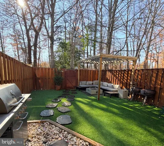 a view of a backyard with sitting area