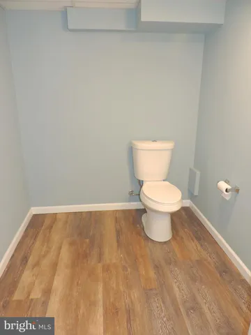 a bathroom with a sink mirror and vanity