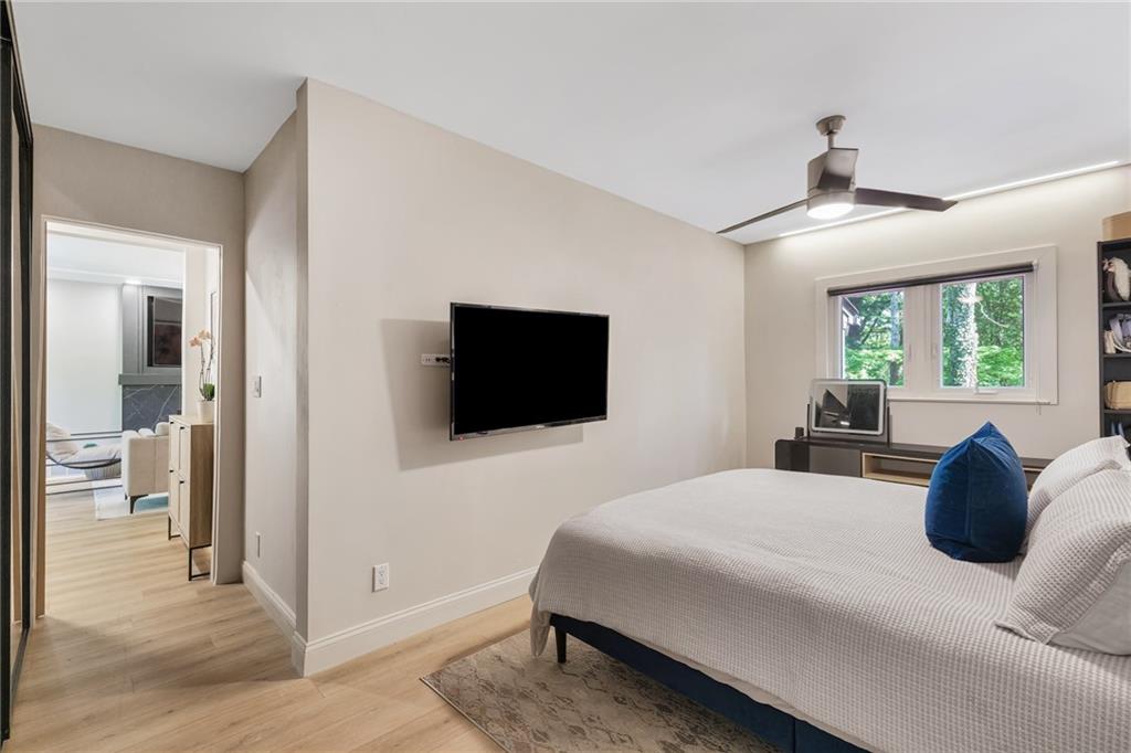2413 North Decatur Road Decatur, GA 30033 - Photo 18 of 33 a bedroom with a bed and a flat screen tv