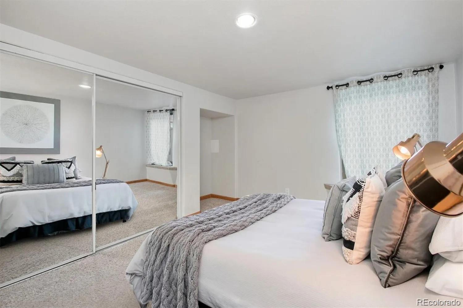 3201 Stuart Street Denver, CO 80212 - Photo 15 of 25 a bedroom with bed and window