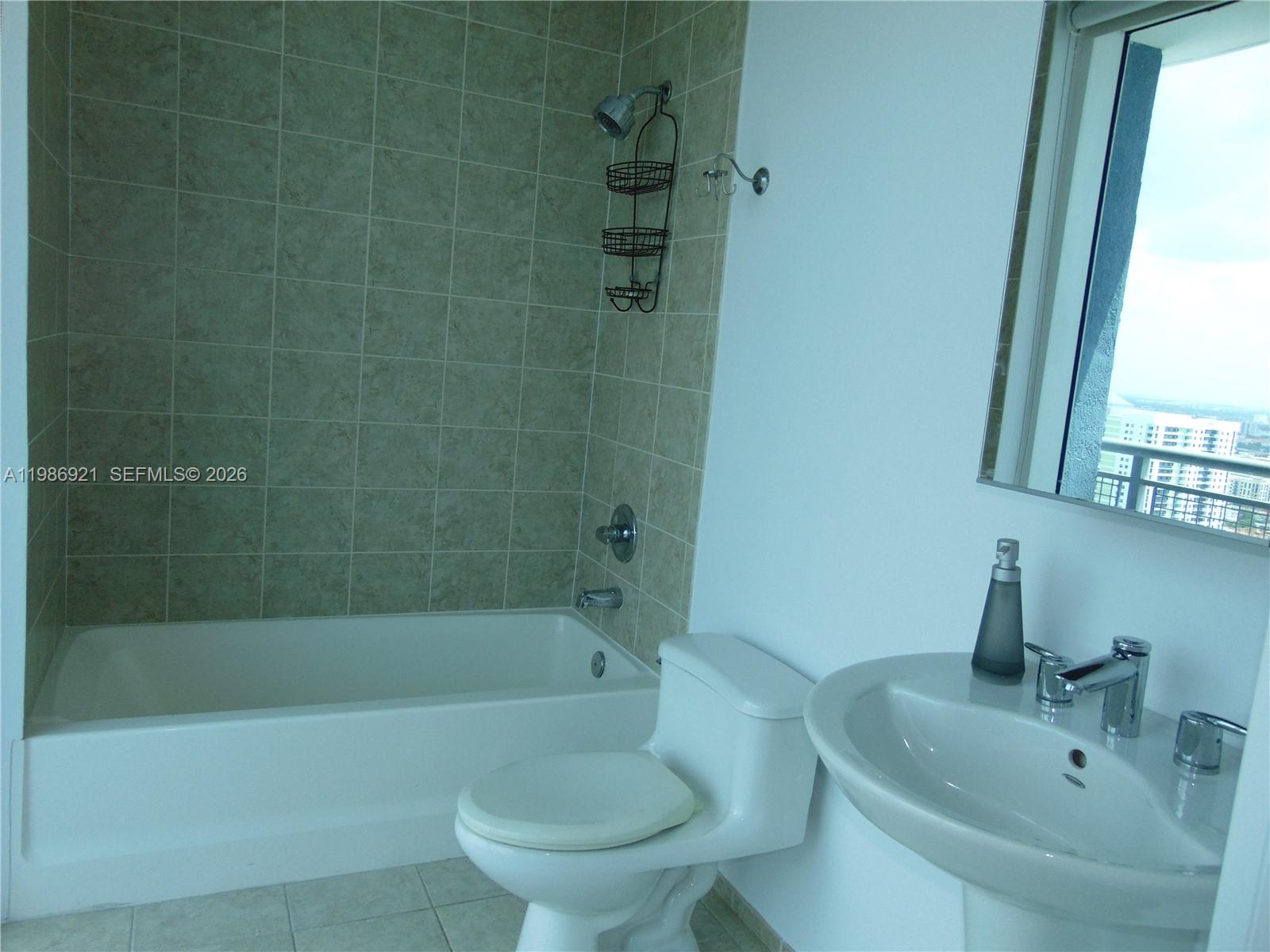 60 Southwest 13th Street, Unit 2619 Miami, FL 33130 - Photo 13 of 27 a bathroom with a sink a toilet and bathtub