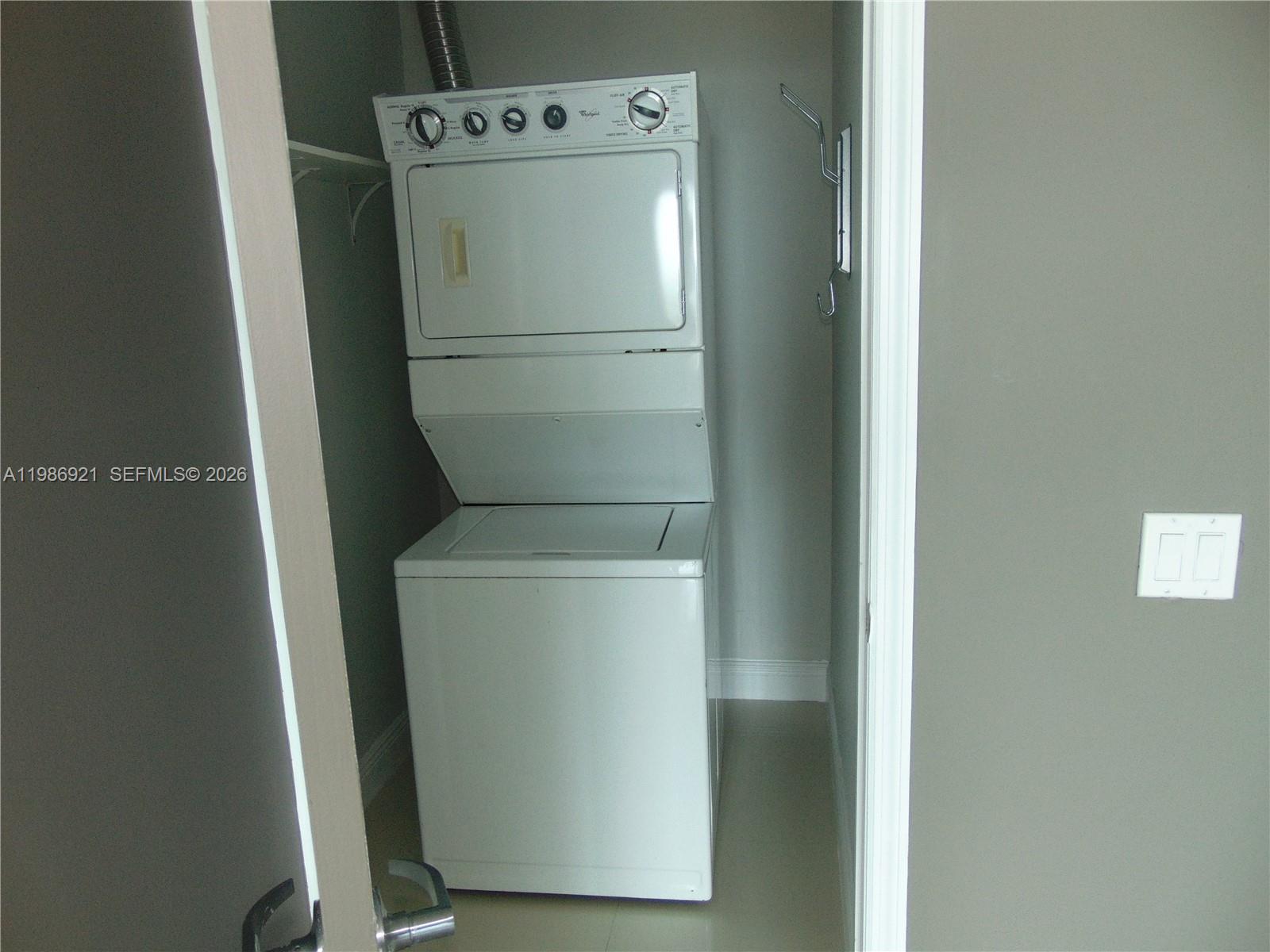 60 Southwest 13th Street, Unit 2619 Miami, FL 33130 - Photo 7 of 27 a utility room with dryer and washer