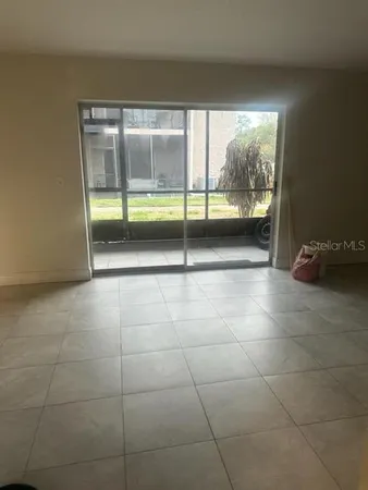 a view of an empty room with a sliding door