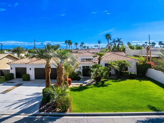 a view of a house with outdoor space and sitting area