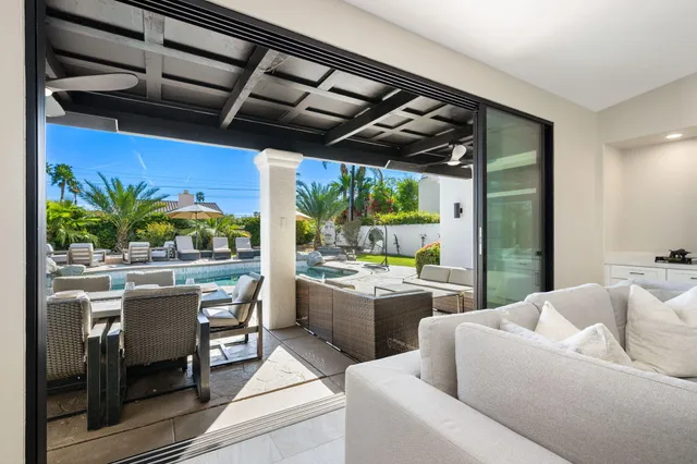 a view of a backyard with sitting area