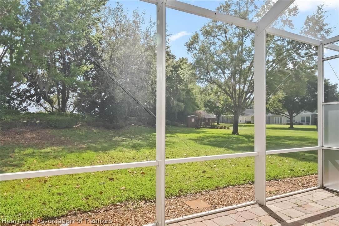 5224 Haw Branch Road Sebring, FL 33875 - Photo 16 of 40 a view of a room with a big yard and large trees