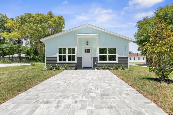 front view of a house with a yard