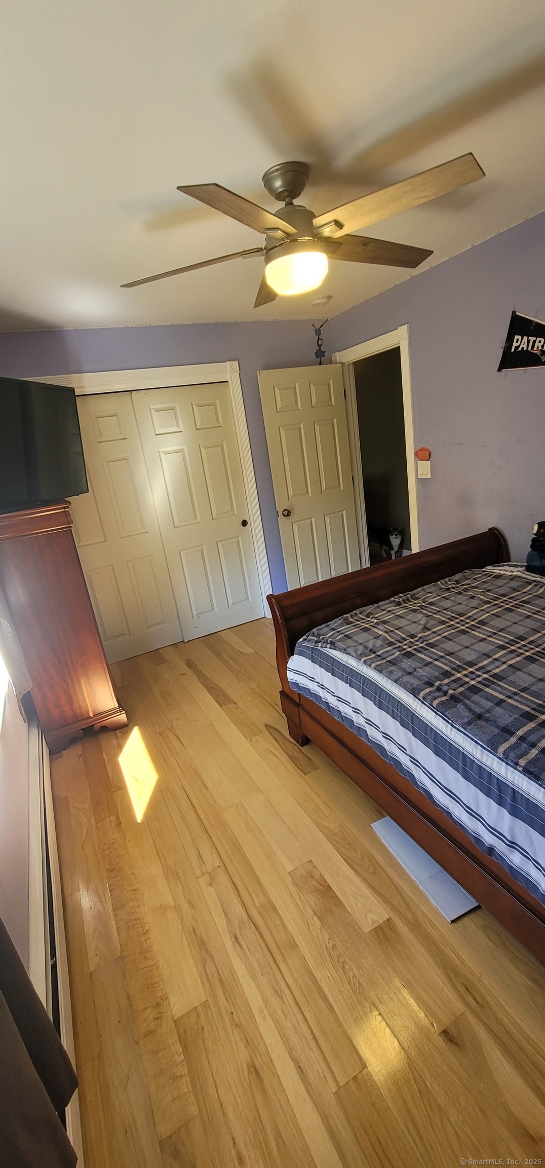 108 Webb Circle Monroe, CT 06468 - Photo 12 of 24 a bedroom with a bed and lamp on wall