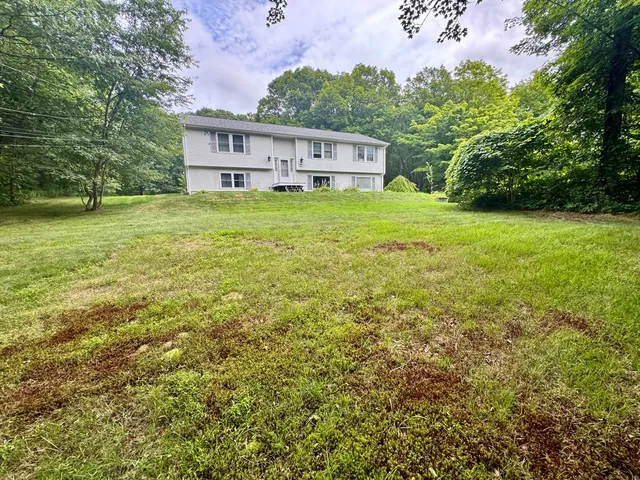 a view of a house with a big yard