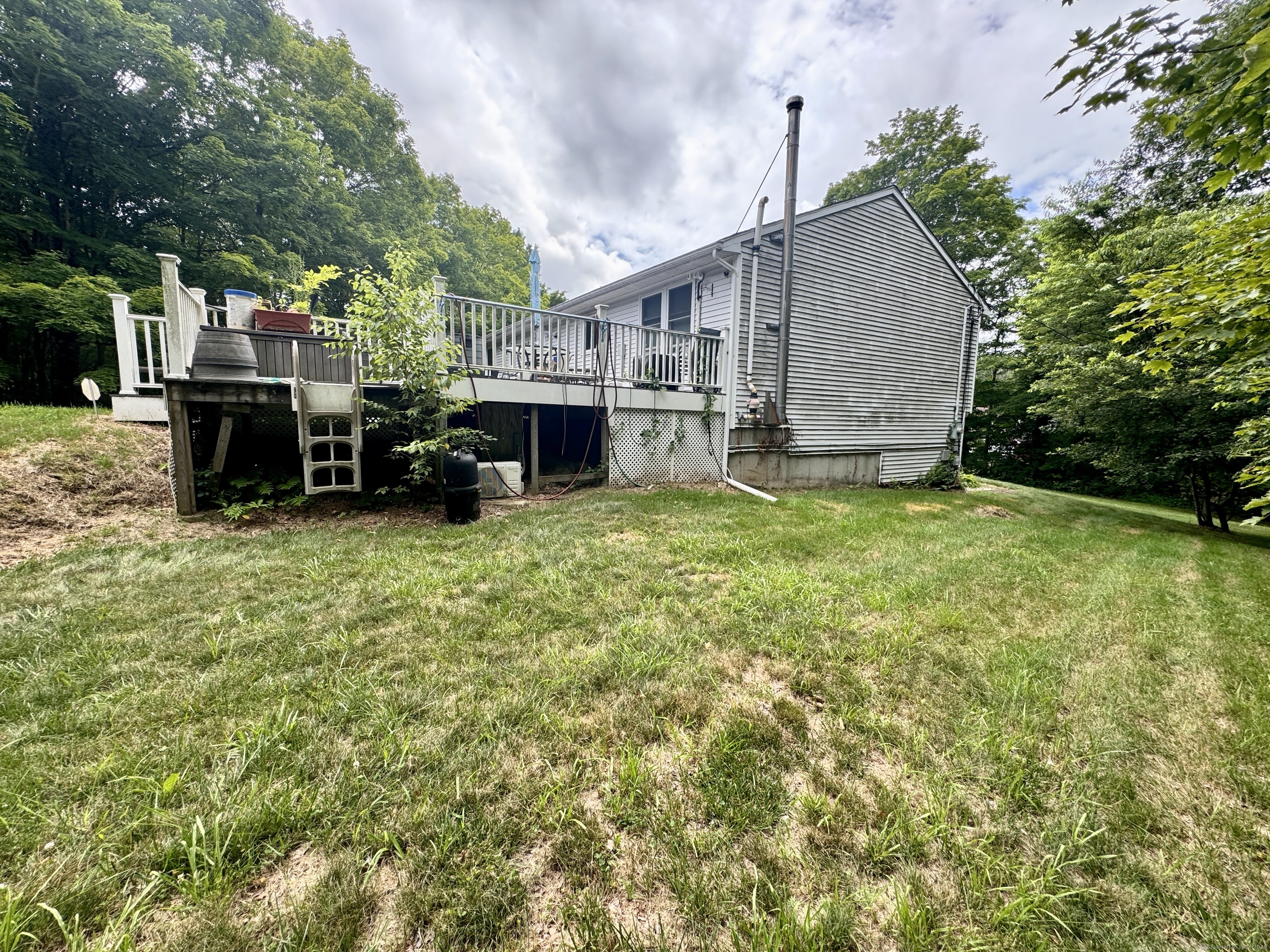 108 Webb Circle Monroe, CT 06468 - Photo 21 of 24 a view of a house with a yard and sitting area