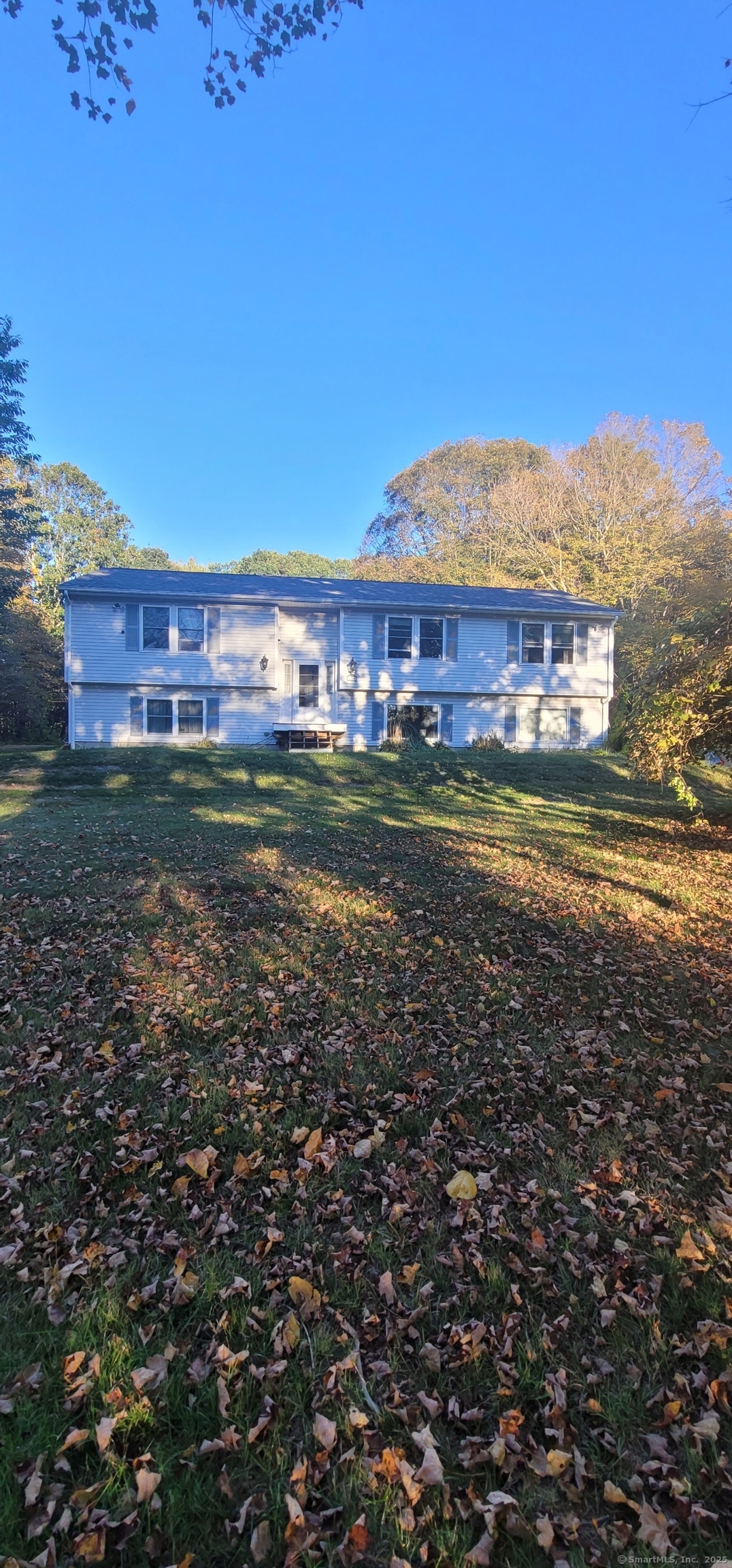 108 Webb Circle Monroe, CT 06468 - Photo 3 of 24 a view of a big room with a big yard