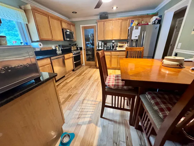 a view of a living room with furniture and a flat screen tv