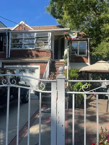 a front view of a house with yard