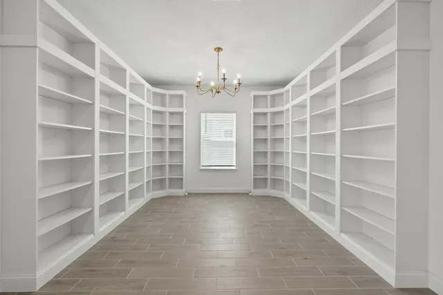 a kitchen with stainless steel appliances a sink a stove and a wooden floors