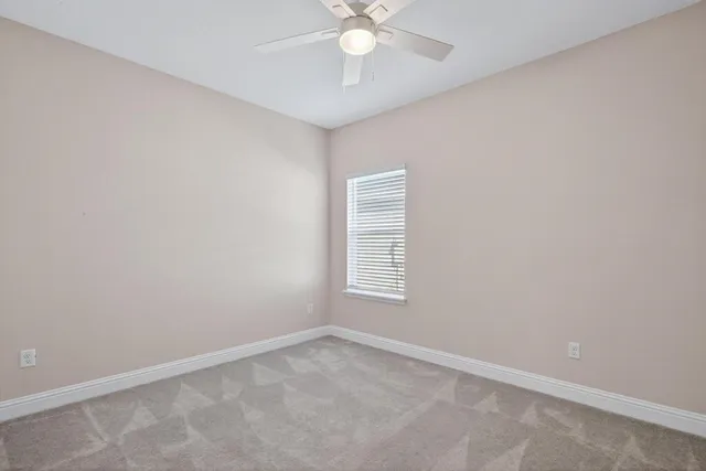 a view of a patio with a table chairs and a potted plants