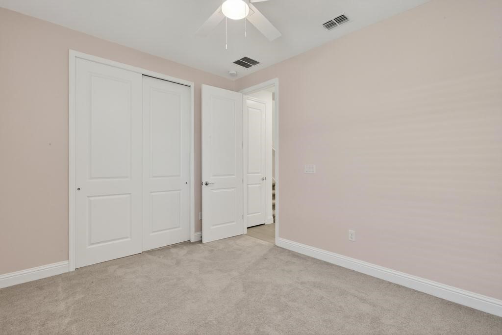 75776 Estuary Way Yulee, FL 32097 - Photo 38 of 83 an empty room with a ceiling fan