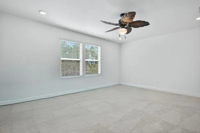 a living room with lots of furniture and a rug
