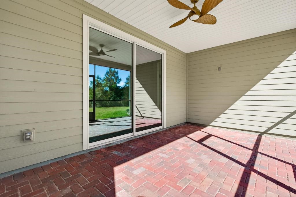 75776 Estuary Way Yulee, FL 32097 - Photo 48 of 83 a view of a balcony with a floor to ceiling window and wooden floor