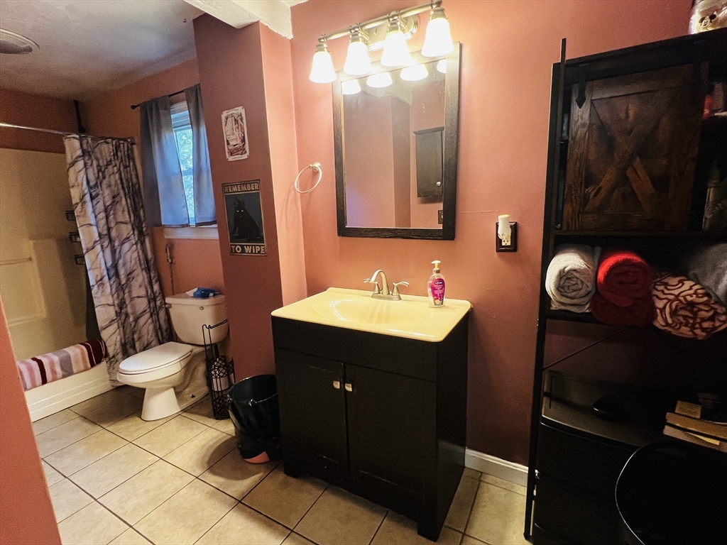 4 Hastings Road Spencer, MA 01562 - Photo 11 of 16 a bathroom with a sink and mirror with toilet