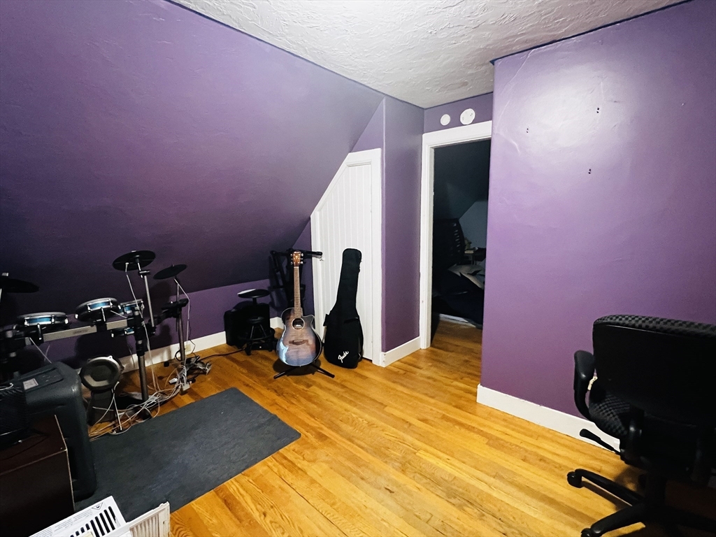 4 Hastings Road Spencer, MA 01562 - Photo 12 of 16 a room with gym equipment and a mirror