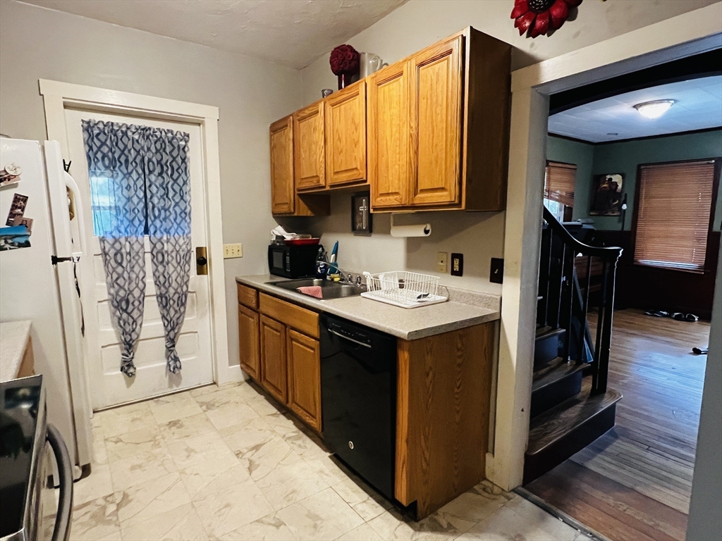 4 Hastings Road Spencer, MA 01562 - Photo 8 of 16 a kitchen with a sink and cabinets