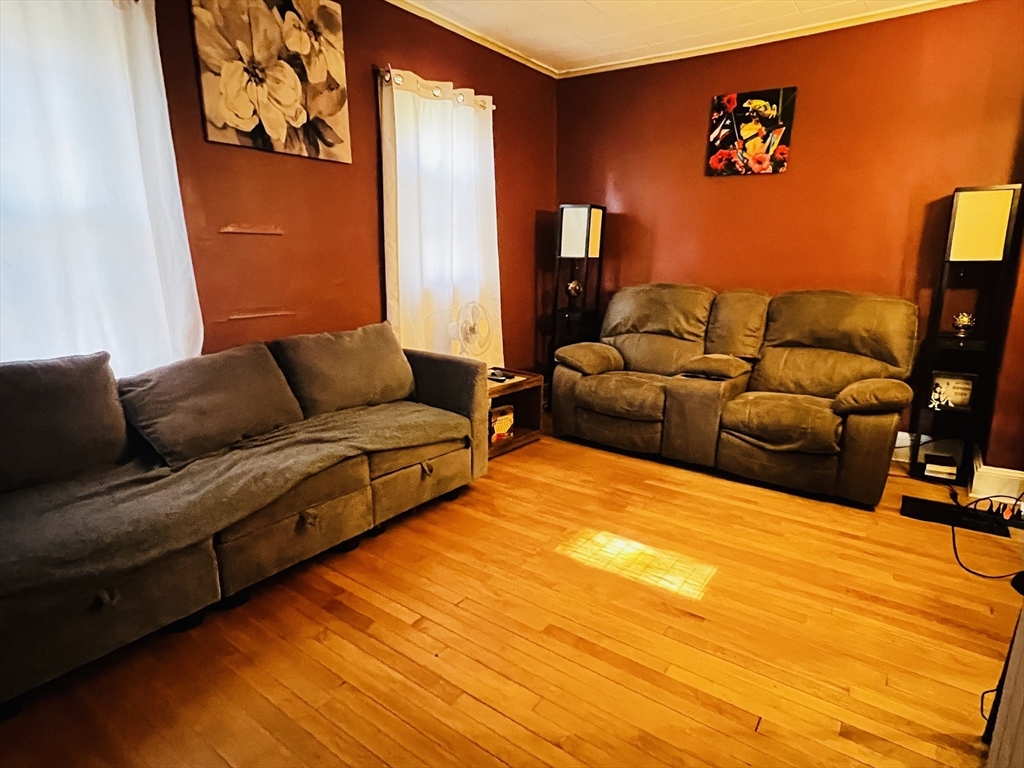 4 Hastings Road Spencer, MA 01562 - Photo 9 of 16 a living room with furniture and a flat screen tv