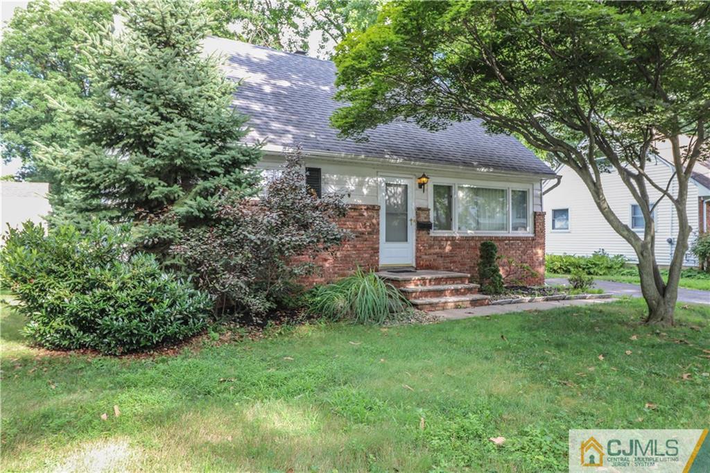 8 Kelly Street Metuchen, NJ 08840 - Photo 2 of 25 a front view of house with yard and green space