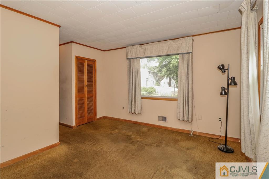 8 Kelly Street Metuchen, NJ 08840 - Photo 14 of 25 a view of an empty room with a window