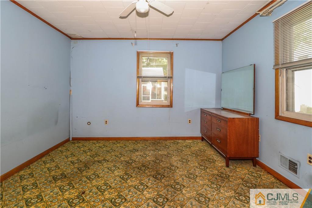 8 Kelly Street Metuchen, NJ 08840 - Photo 15 of 25 a room with window and a dresser
