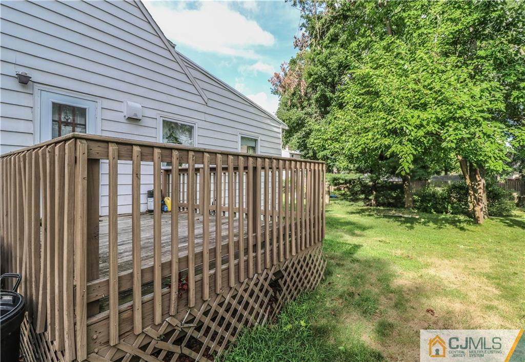 8 Kelly Street Metuchen, NJ 08840 - Photo 25 of 25 a view of a backyard with plants and wooden fence